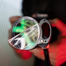Load image into Gallery viewer, A detailed close-up of the LLPLAB V5 100mm Stretch Filter (50% intensity) securely attached to a camera via a magic arm. This setup showcases how the filter’s moderate and controllable stretch effect can be precisely positioned and stably used for videography or still photography, combining creative flexibility with shooting stability.