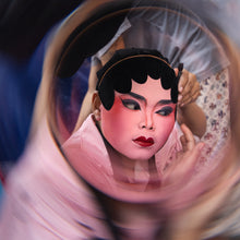 Load image into Gallery viewer, A cinematic portrait captured using the LLP V4 Black Halo Prism Filter. The model is accentuated by the filter’s unique dark-edged light leaks and ethereal bokeh, creating a dramatic and emotive atmosphere.

