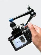 Load image into Gallery viewer, The LLPLAB 11-inch Articulating Magic Arm with Clamp shown mounted to a camera rig. This accessory provides a flexible and secure way to position cameras, lights, or other gear like handheld filters at virtually any angle, greatly expanding creative setup possibilities for photography and videography.
