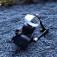 Load image into Gallery viewer, The LLPLAB V4 Linear Prism Filter shown in a professional setup, securely mounted to a DSLR camera via a flexible magic arm. This configuration demonstrates how the handheld filter can be transformed into a stable, fixed creative tool, allowing for precise composition and repeatable effects during photo or video shoots.
